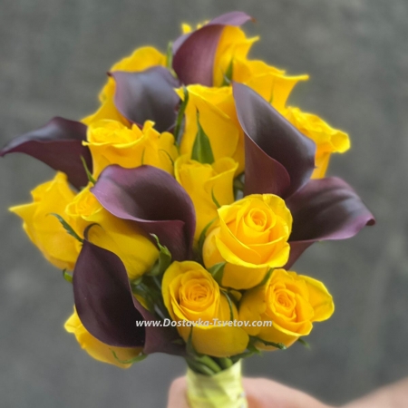 Black calla lilies and roses in a bouquet