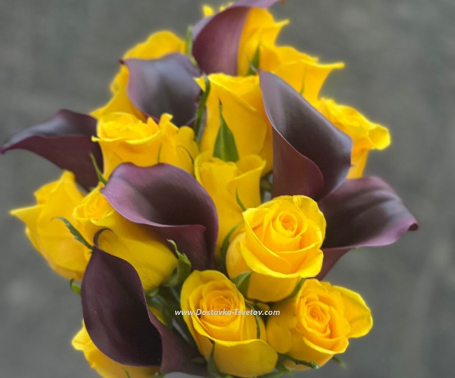 Yellow roses Black calla lilies and roses in a bouquet